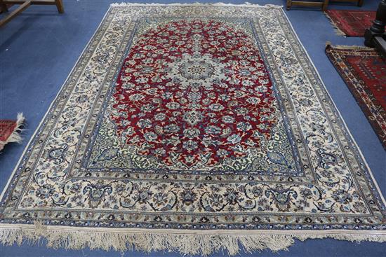 An Isfahan ground ivory carpet, 305cm x 216cm